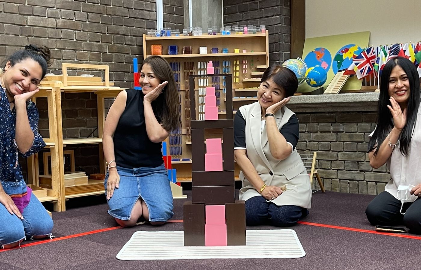 Teachers and parents participating in a SEELS Bite-Size Montessori training and demonstration
